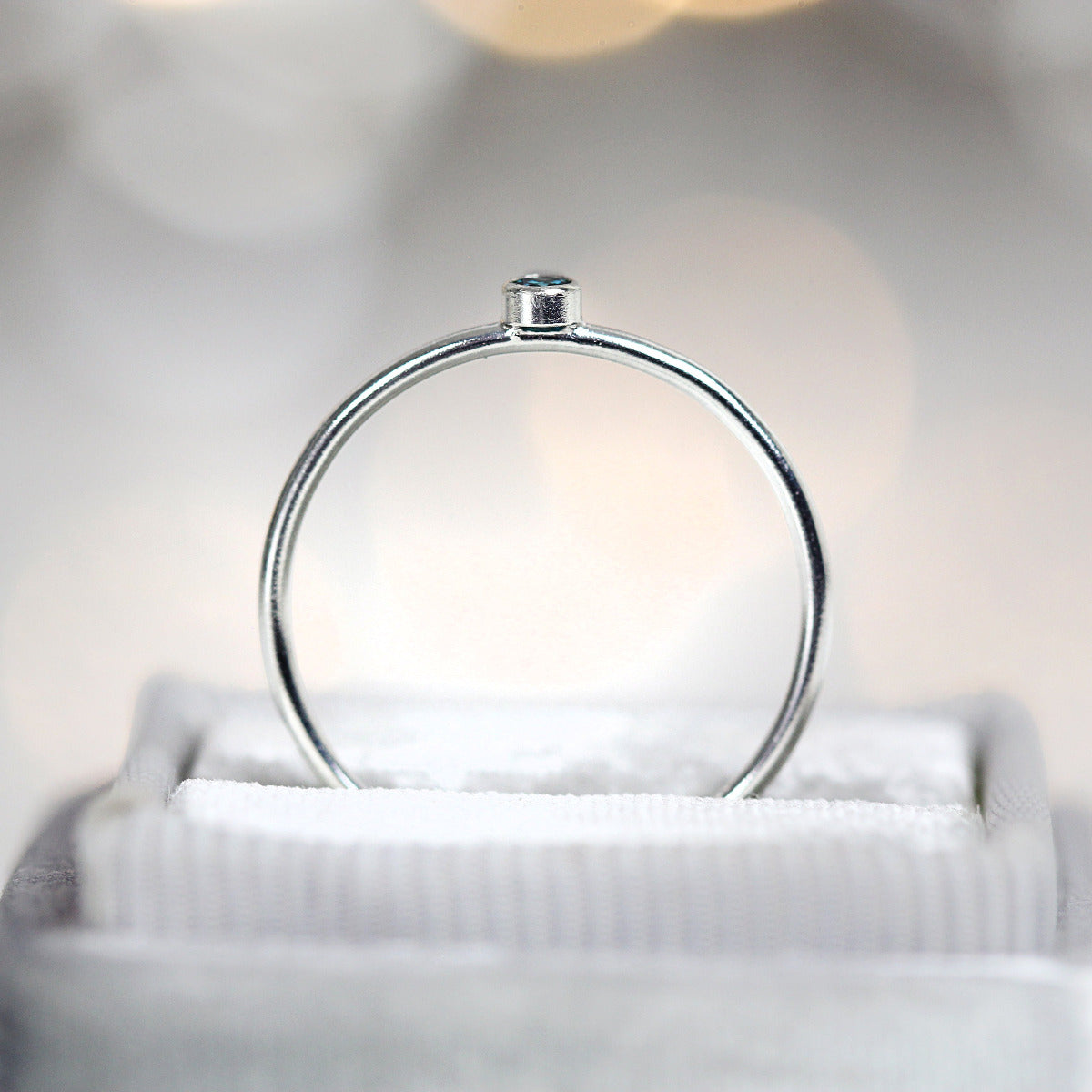 Silver minimal ring band displayed in a jewellery box