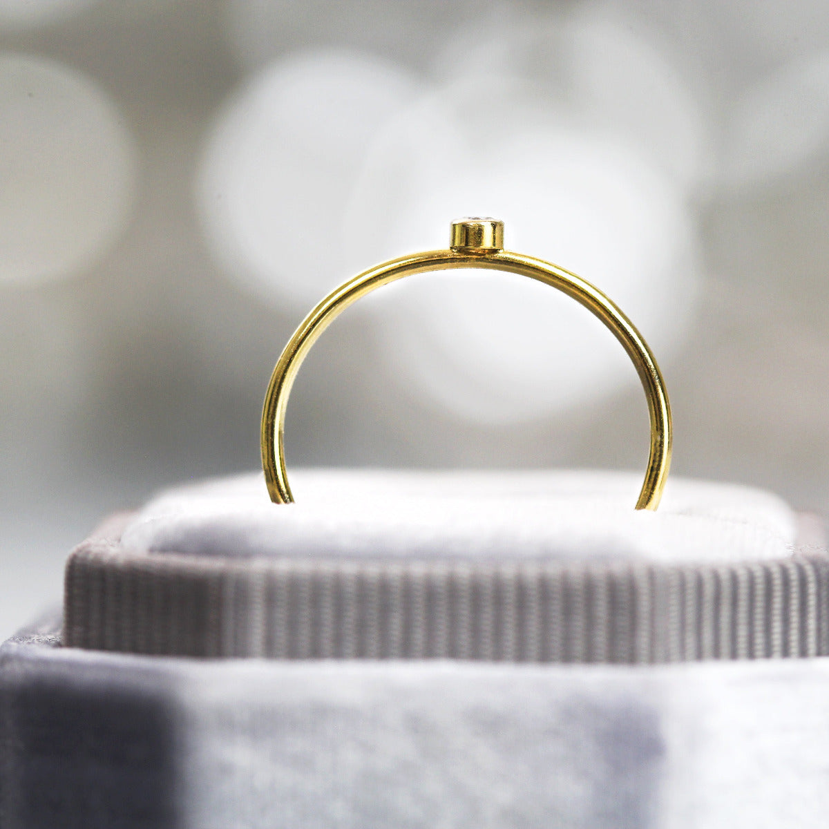 Silver minimal ring band displayed in a jewellery box